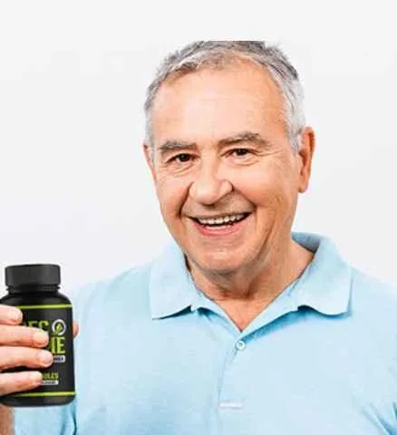 Senior man holding an ErecPrime supplement bottle in a customer-style product image.